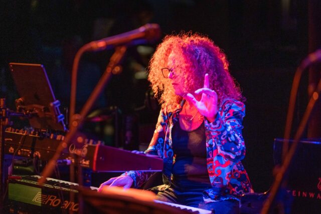 This is a photo of Janette Mason playing keyboards